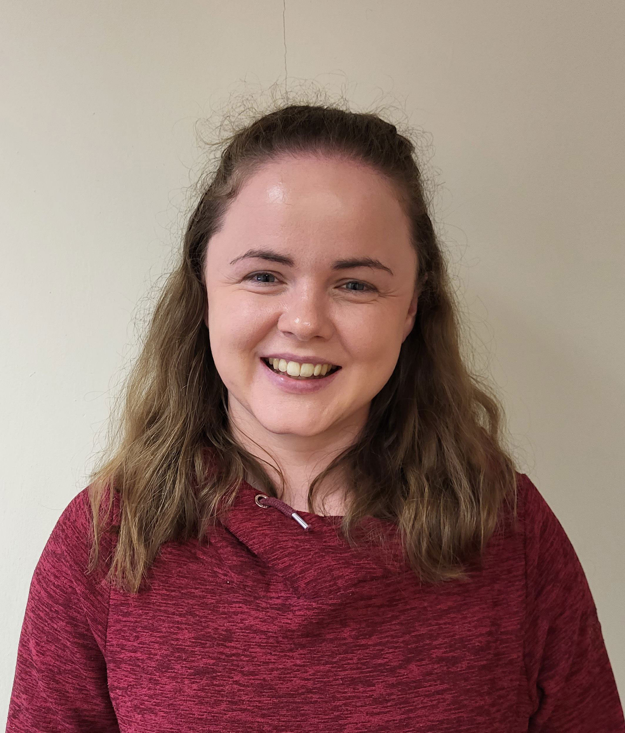 A woman wearing a red jumper