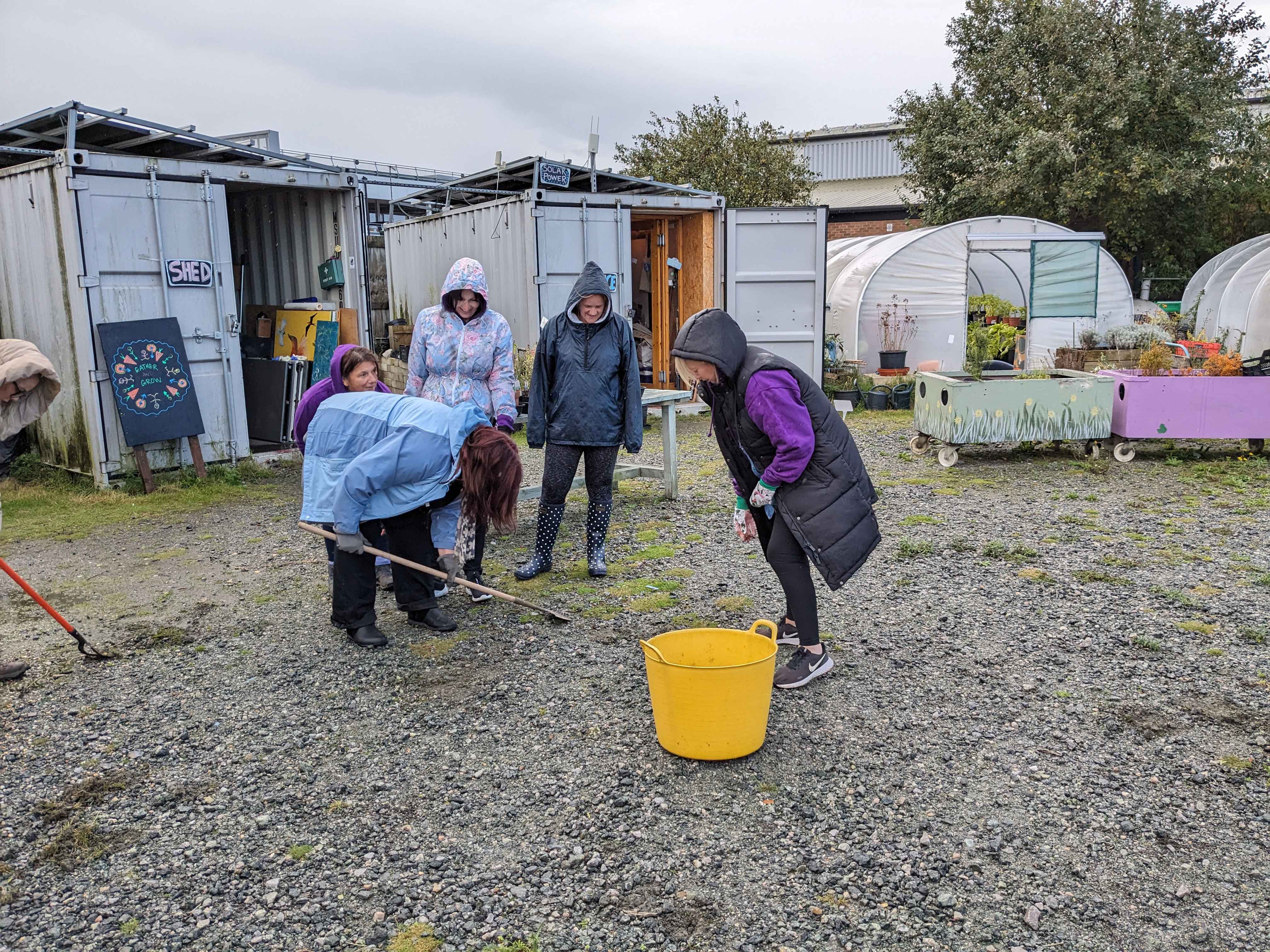 A group of women stood in an allotment 