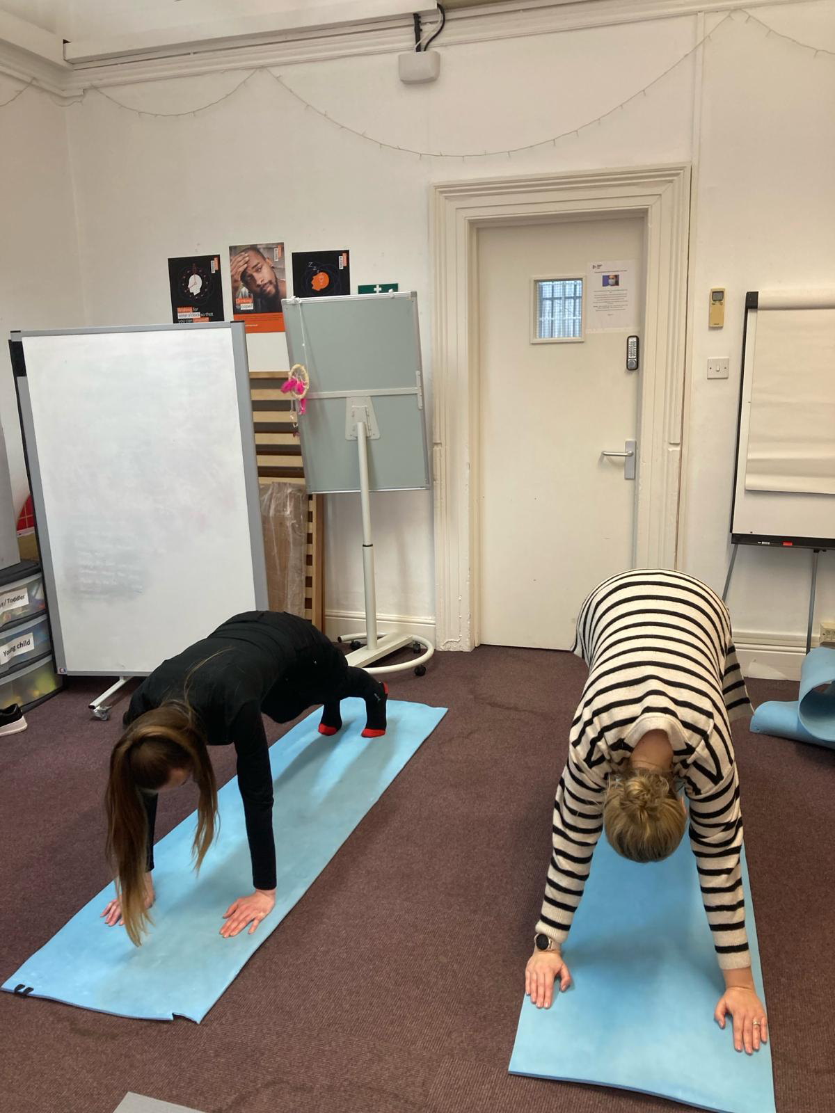 Two women doing yoga