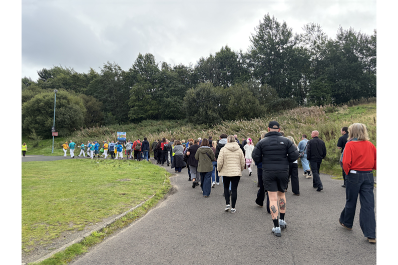 A group of people walking in the countryside