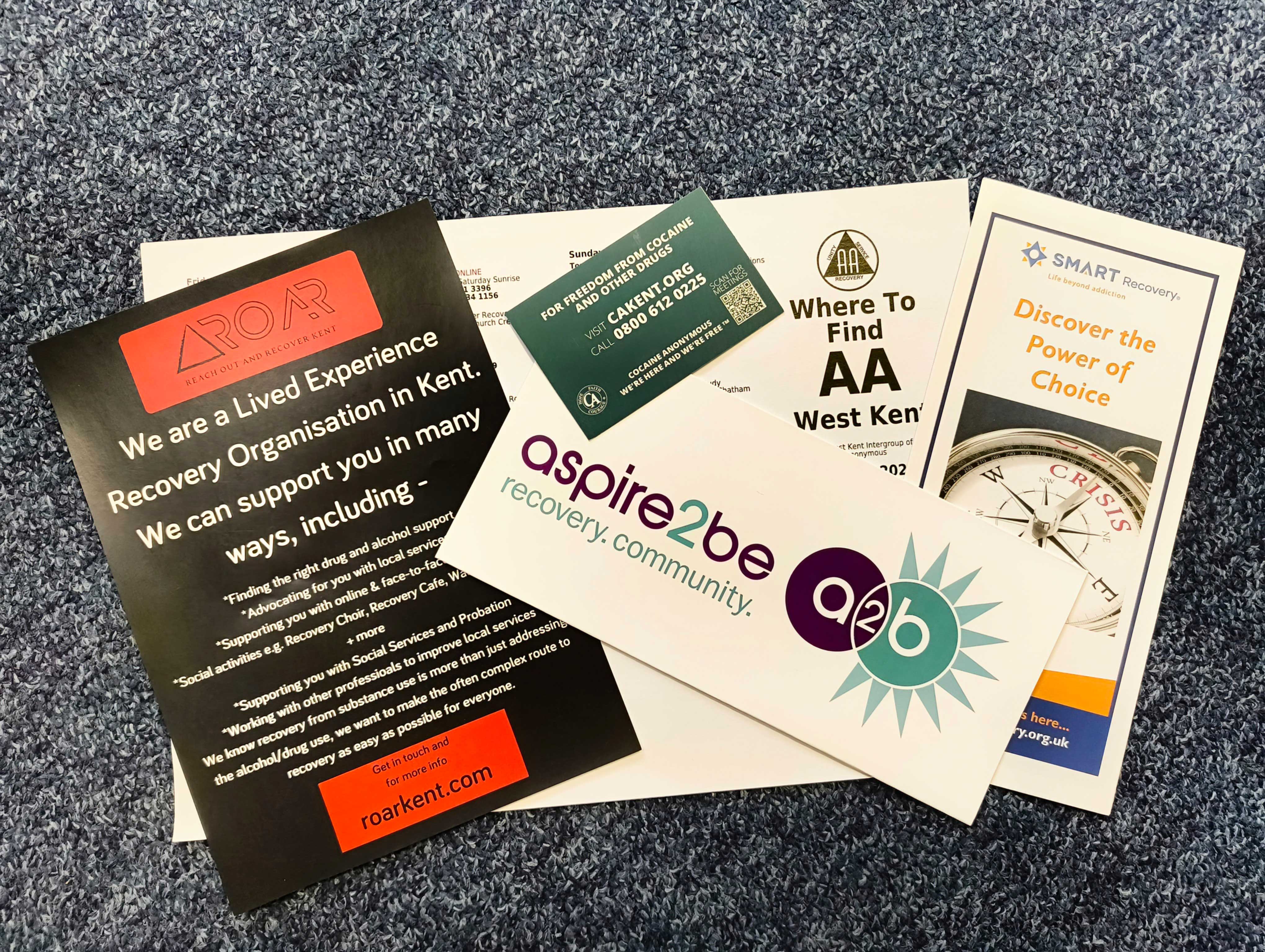 A selection of leaflets arranged on the floor