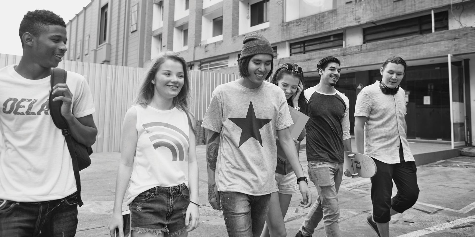 Group of young people walking together