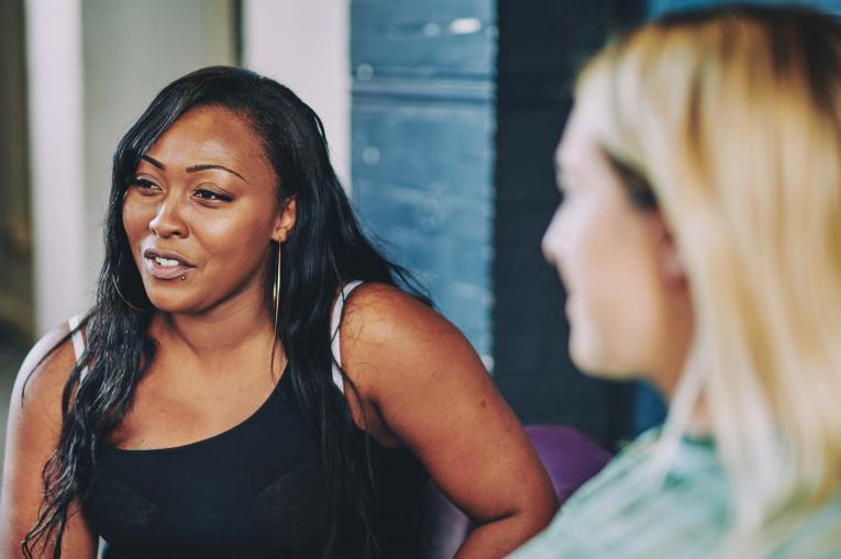 a woman looking off to the distance while talking