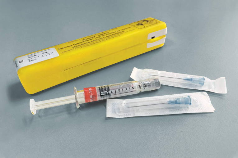 naloxone kit (opioid overdose reversal drug) with syringe, needles and yellow packet