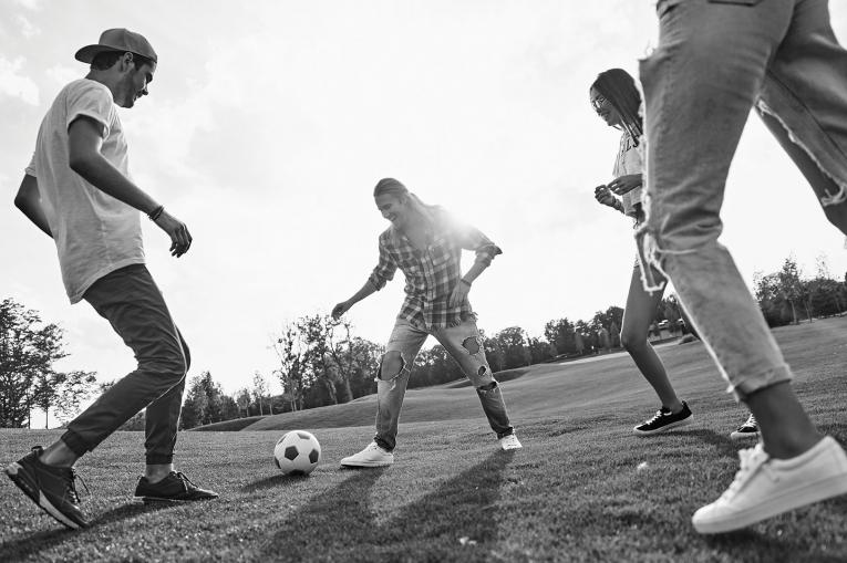 Young people playing football