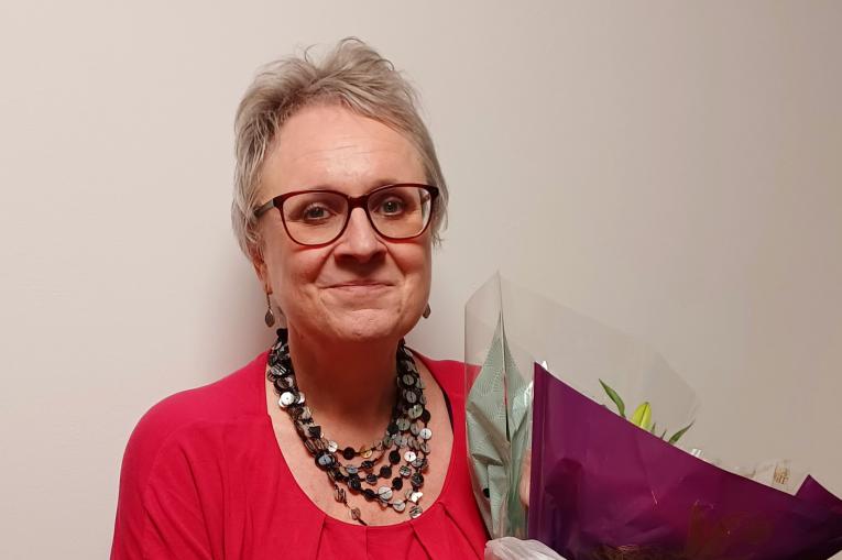 A woman holding a bouquet of flowers