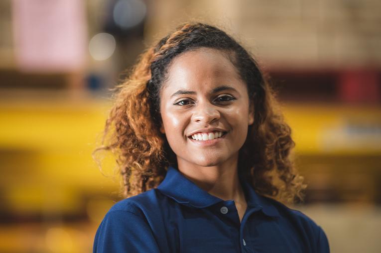 A women wearing blue overalls