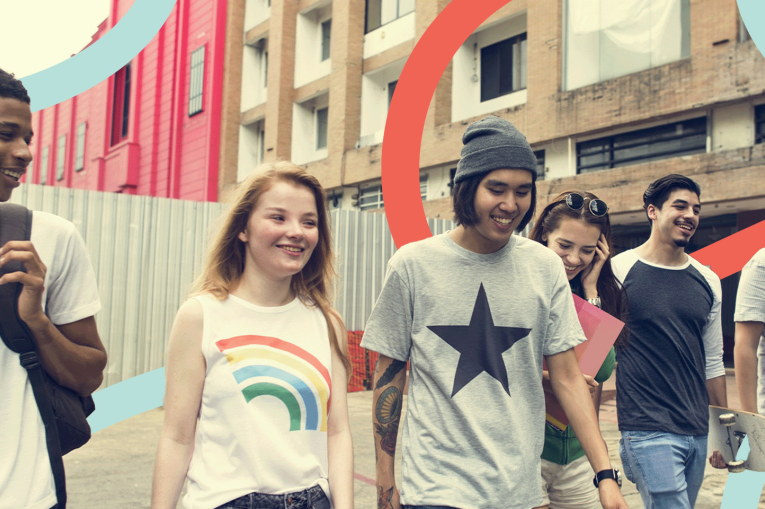 a group of young people walking and smiling