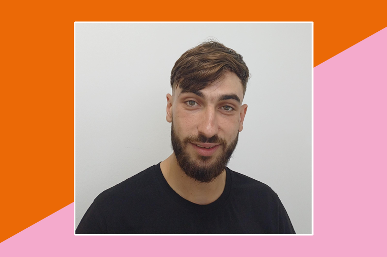 Orange and pink seperated on a diagonal with a photo of Dragos on top. He has short brown hair, a beard and mustache.