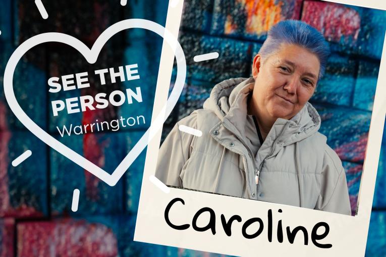 A colourful wall background with a heart stamp on the left with the words See The Person Warrington inside the heart. On the right is a polaroid photo with a women with cropped blue hair and wearing a grey coat. The name Caroline is at the bottom of the polaroid.