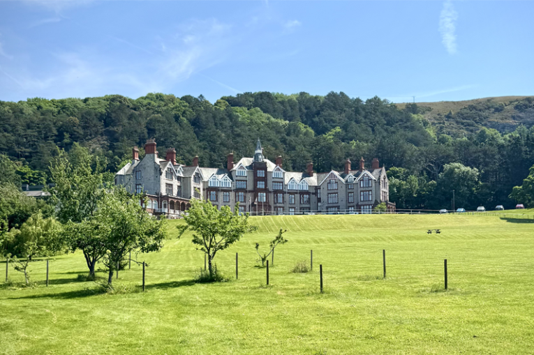 A grand manor house set in the Welsh countryside