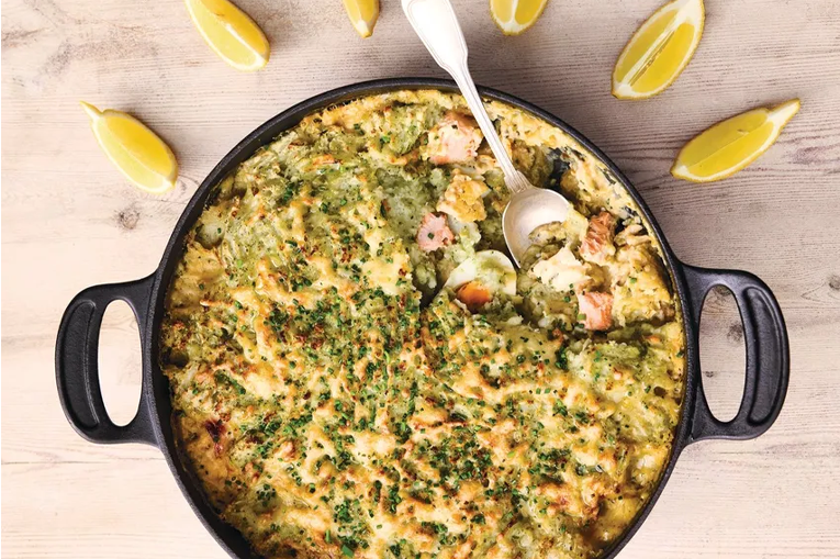 A cast iron skillet containing fish pie