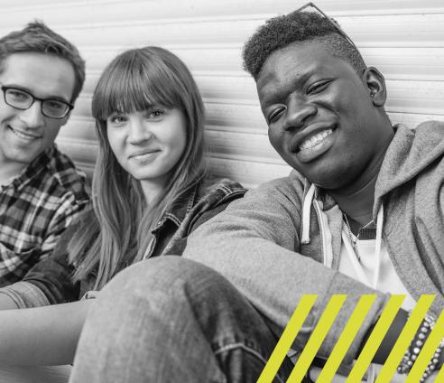 Three young people taking a group selfie