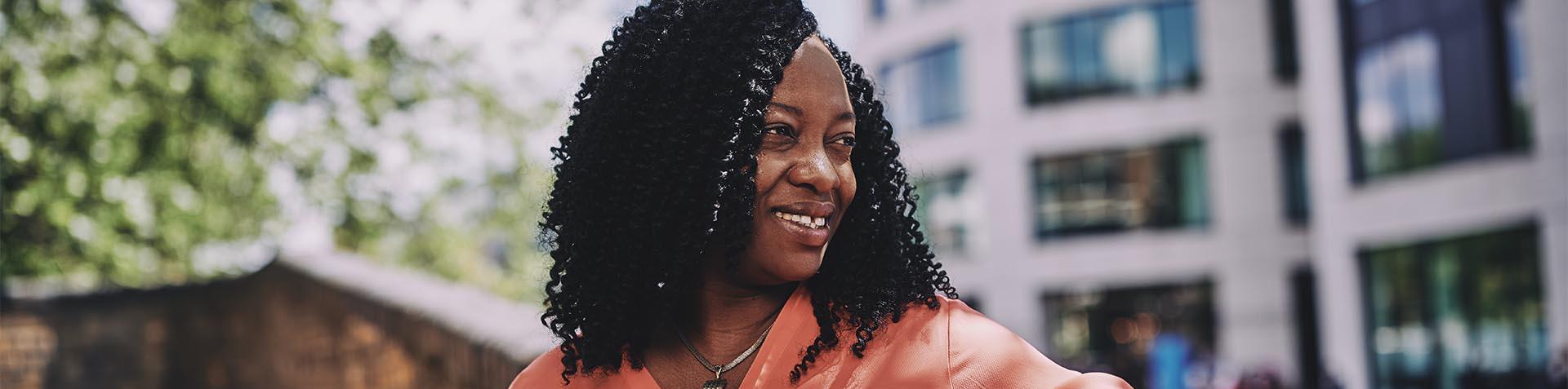 woman looking over her shoulder smiling