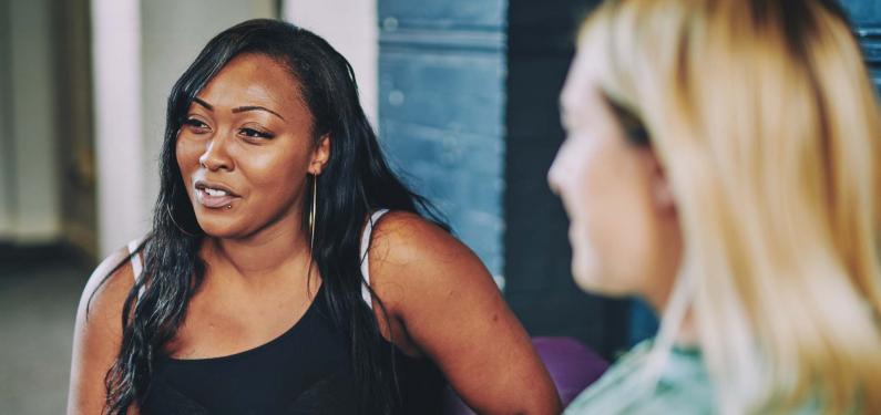 a woman looking off to the distance while talking