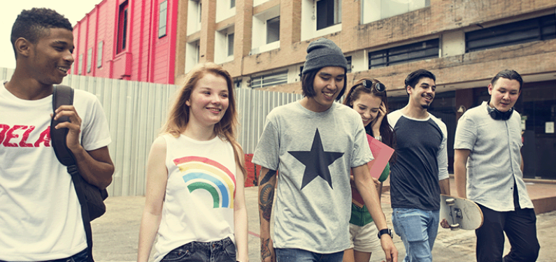 Group of young people walking and talking