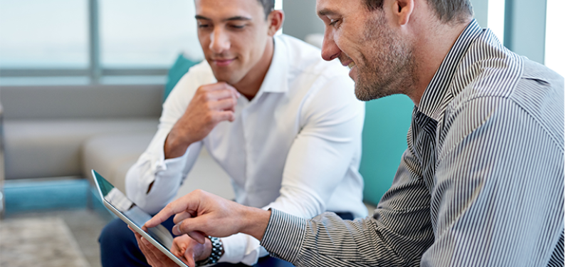 two people in a service setting discussing a plan together