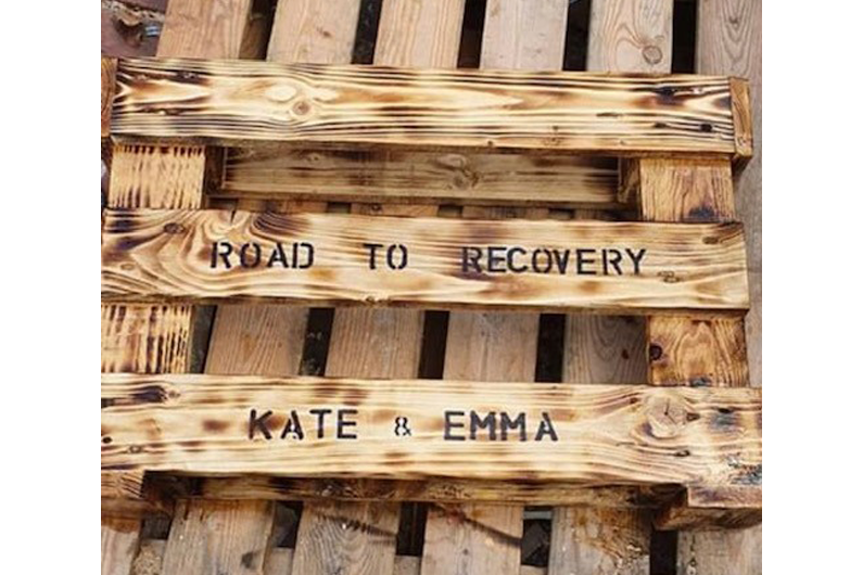 A bench with "Road to recovery" written on it