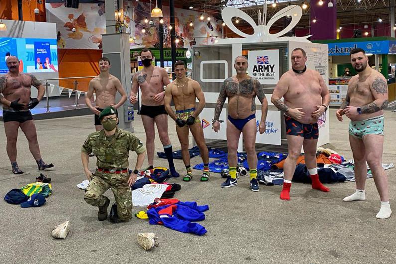 The rugby team stood with their kit off