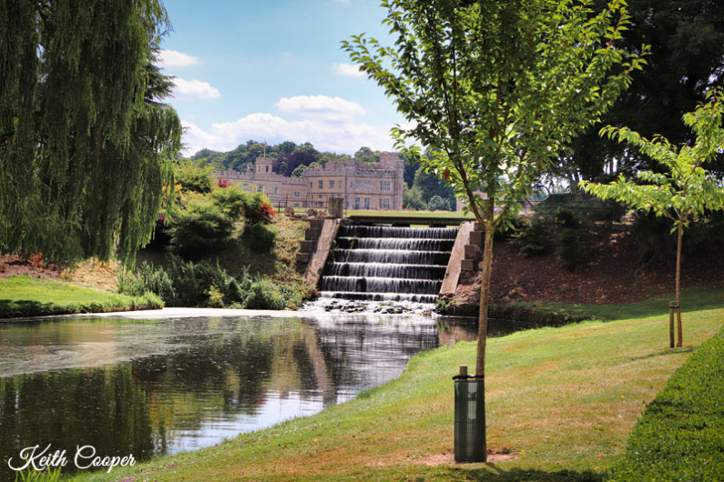 A photo of a waterfall and gardens