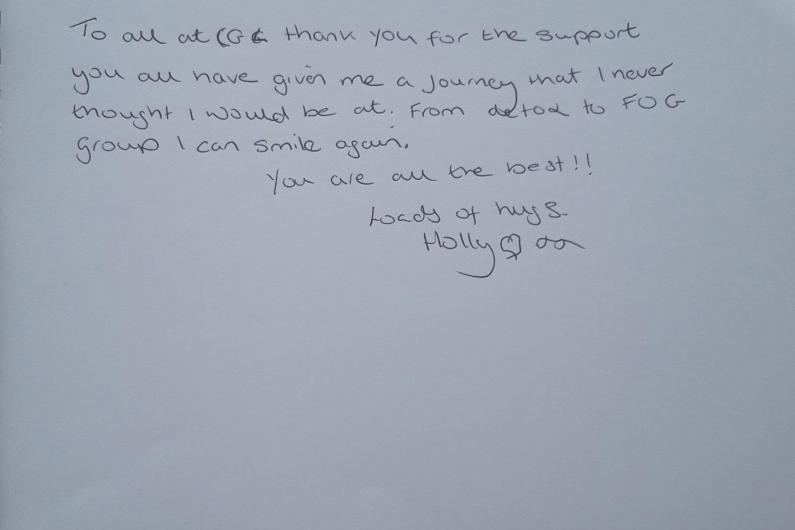 A piece of paper with the words "To all at CGL thank you for the support you all have given me a journey that I never thought I would be at. rom detox to FOG group I can smile again. You are all the best!! Loads of hugs. Holly"