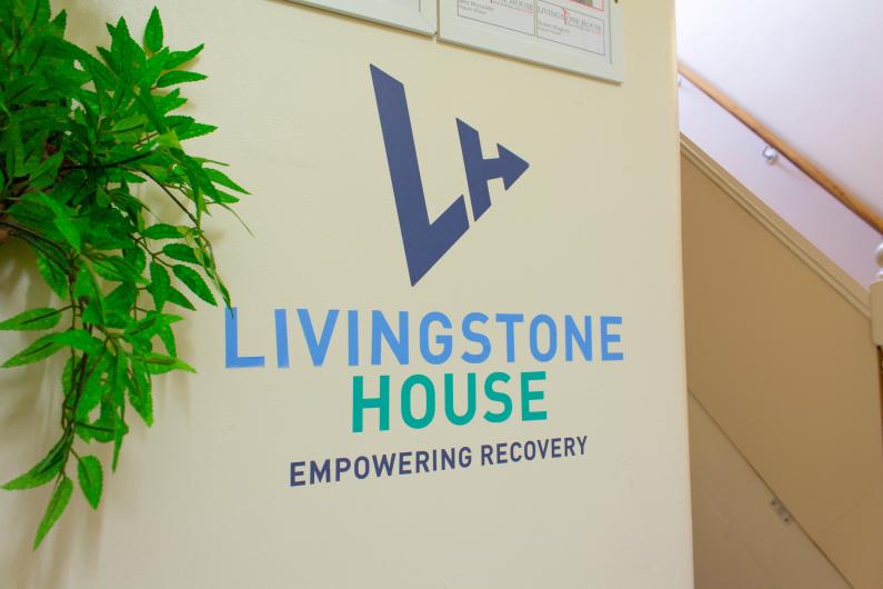  a photo of the Livingstone House logo on an internal wall
