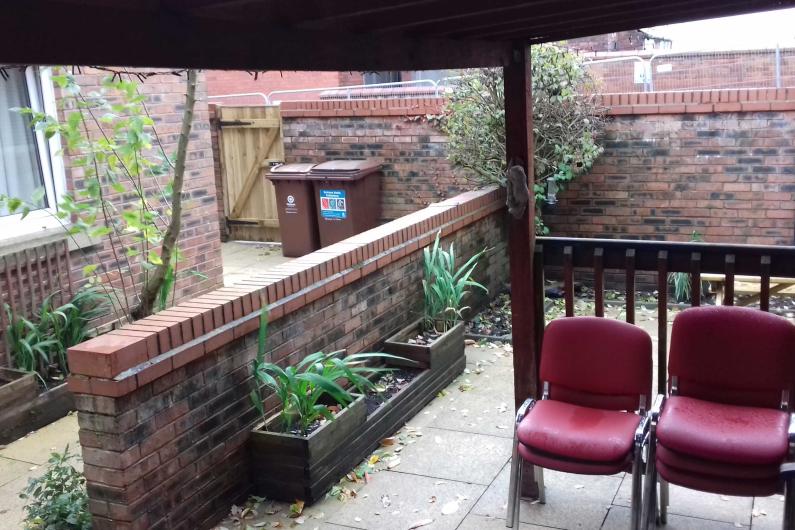 Leigh bank garden - a sheltered deck with seating