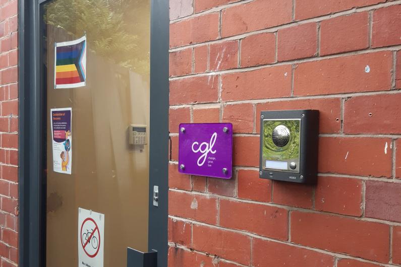 The front door of the Macclesfield service - a red brick building. Buzzer on the right.