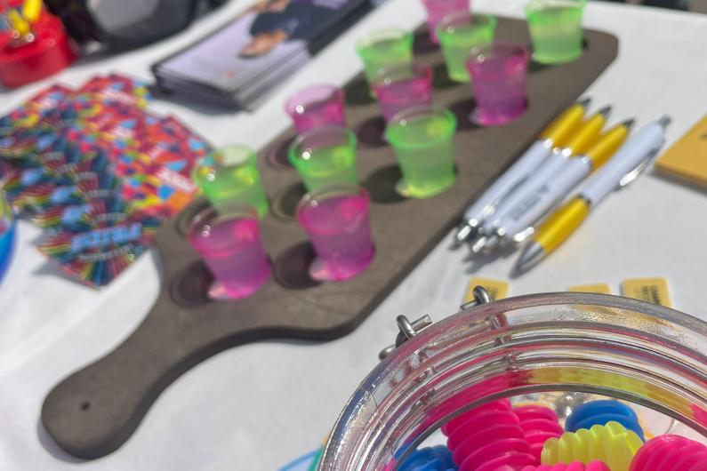 shot glasses and bottle stoppers on a table