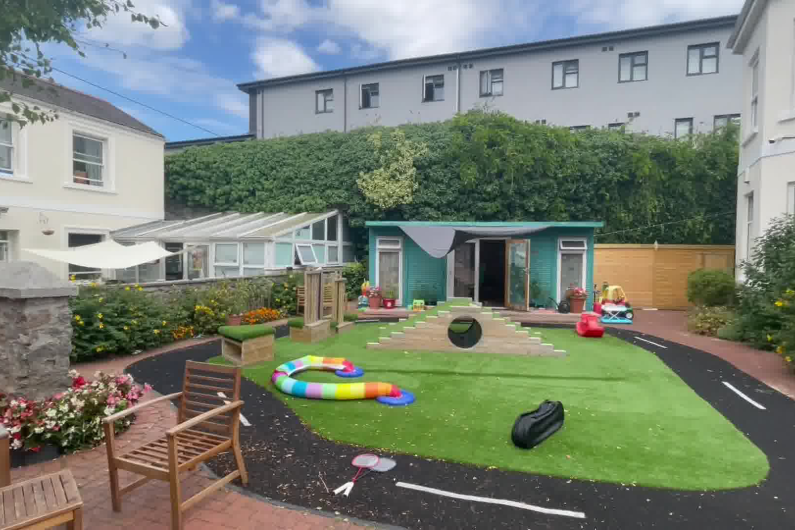 A garden that has children's toys scattered around