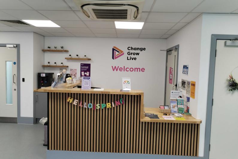A wooden reception desk area